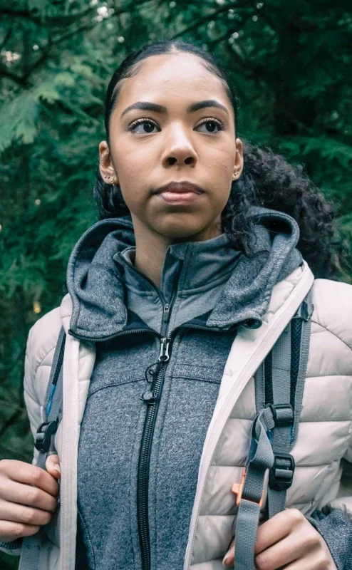 Sylibi - serious young black woman with backpack